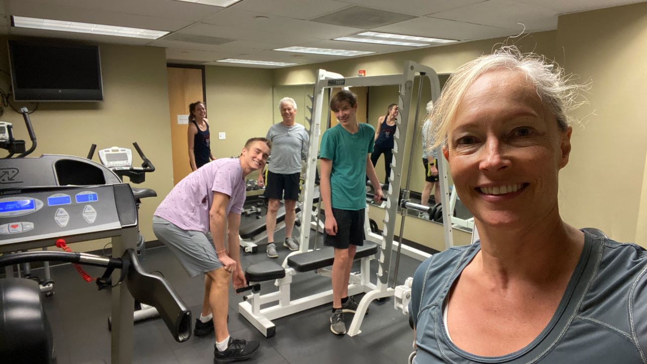 Stutzman says the pandemic brought her family together in unexpected ways. Here, she snapped a selfie while exercising in the basement of her office with her husband David Armitage, sons Palmer and Landon and Palmer's girlfriend Anabelle.