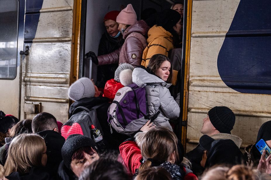 People crowd on a platform as they try to board a westbound train in Kyiv on March 4.