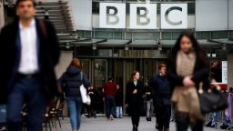 FILE PHOTO: Pedestrians walk past a BBC logo at Broadcasting House in London, Britain, January 29, 2020. REUTERS/Henry Nicholls/File Photo