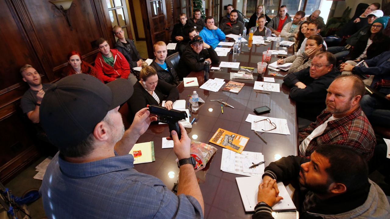 Damon Thueson teaches a packed gun concealed carry permit class put on by "USA Firearms Training" in 2015 in Provo, Utah. 