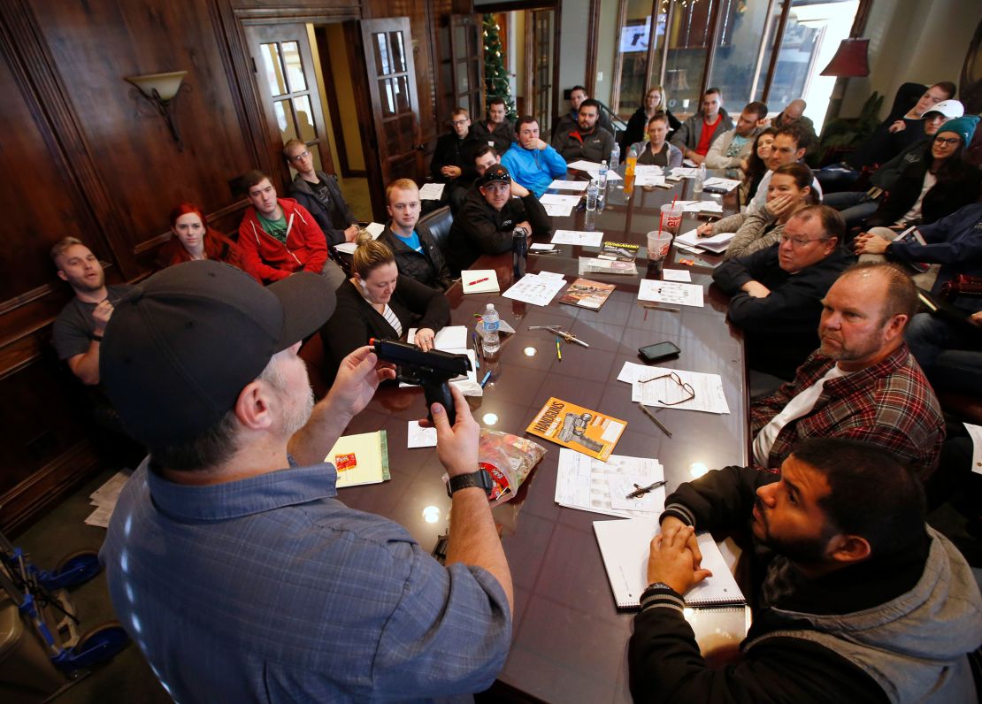 Damon Thueson teaches a packed gun concealed carry permit class put on by "USA Firearms Training" in 2015 in Provo, Utah. 