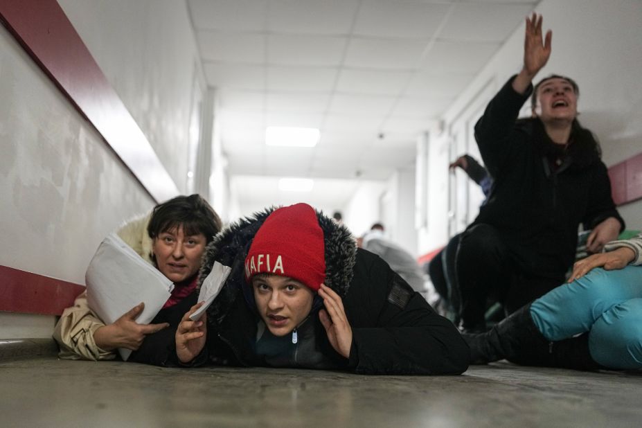 People take shelter on the floor of a hospital during shelling in Mariupol on March 4.