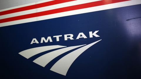 An Amtrak logo is seen on the side of a passenger train. 