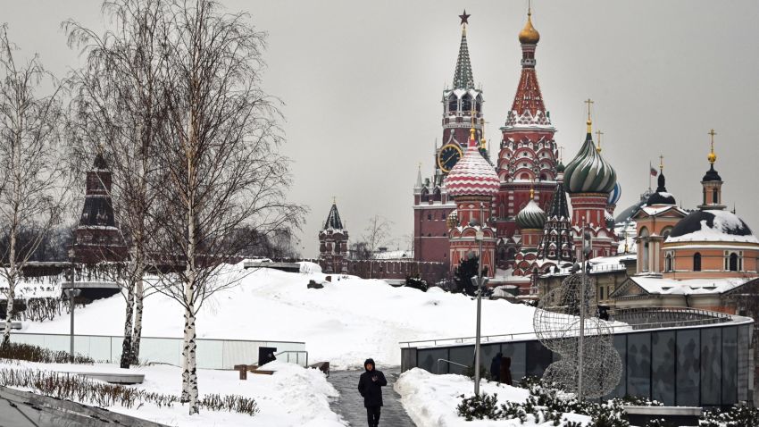 A man walks in front of the Kremlin's Spasskaya tower and St. Basil's cathedral in Moscow on February 3, 2022. - The Kremlin criticised, on February 3, 2022 German regulators for banning the German-language service of Russian state TV network RT. Russian Foreign Minister Sergey Lavrov said reciprocal measures were imminent. (Photo by Alexander NEMENOV / AFP) (Photo by ALEXANDER NEMENOV/AFP via Getty Images)