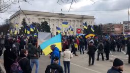Waving Ukrainian flags and chanting, Ukrainians took to the captured streets of Kherson on Saturday, March 5, 2022 to protest Russia's occupation.