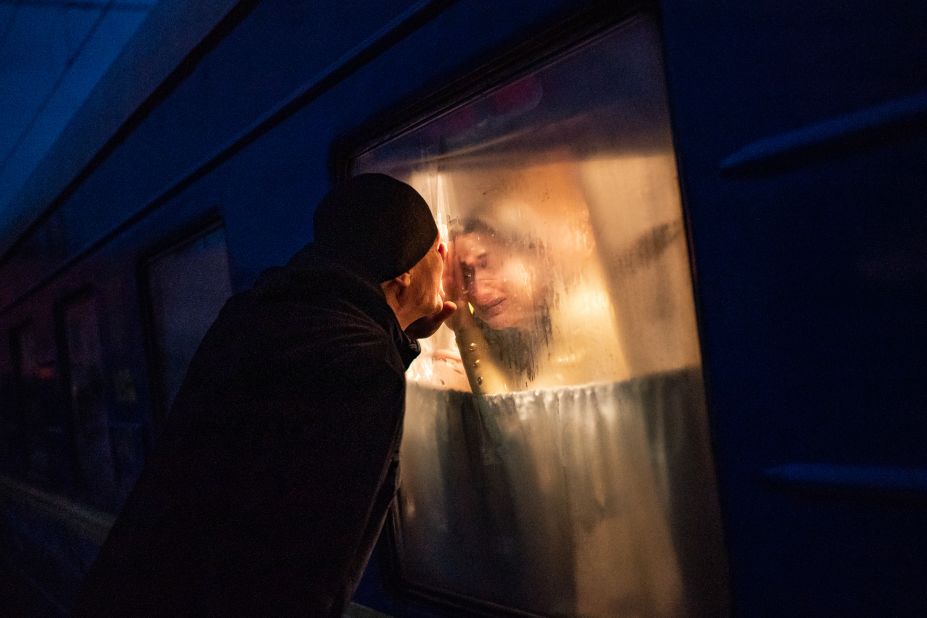 George Keburia says goodbye to his wife and children as they board a train in Odesa on March 5. They were heading to Lviv.