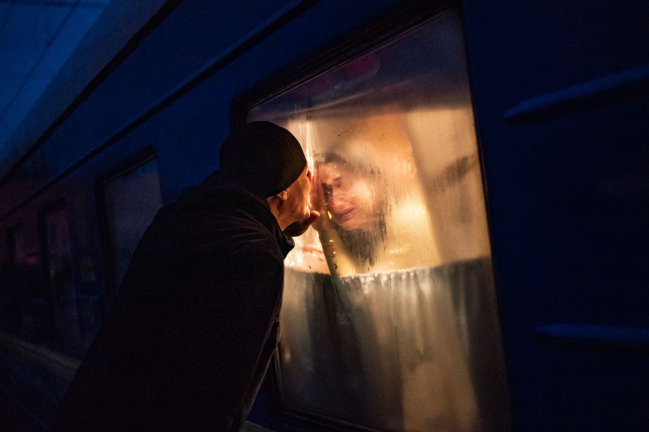 George Keburia says goodbye to his wife and children as they board a train in Odesa on March 5. They were heading to Lviv.