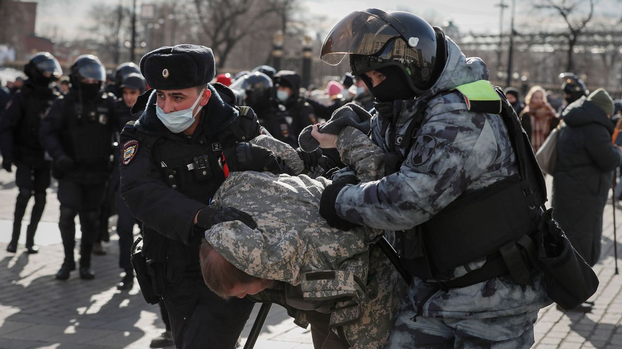 Russian police detain a protester in downtown Moscow on March 6.