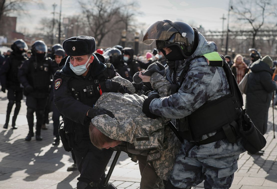 Russian police detain a protester in downtown Moscow on March 6.