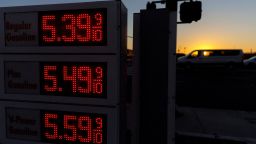  Traffic moves past a sign displaying current gas prices in San Diego, on February 28, 2022.    