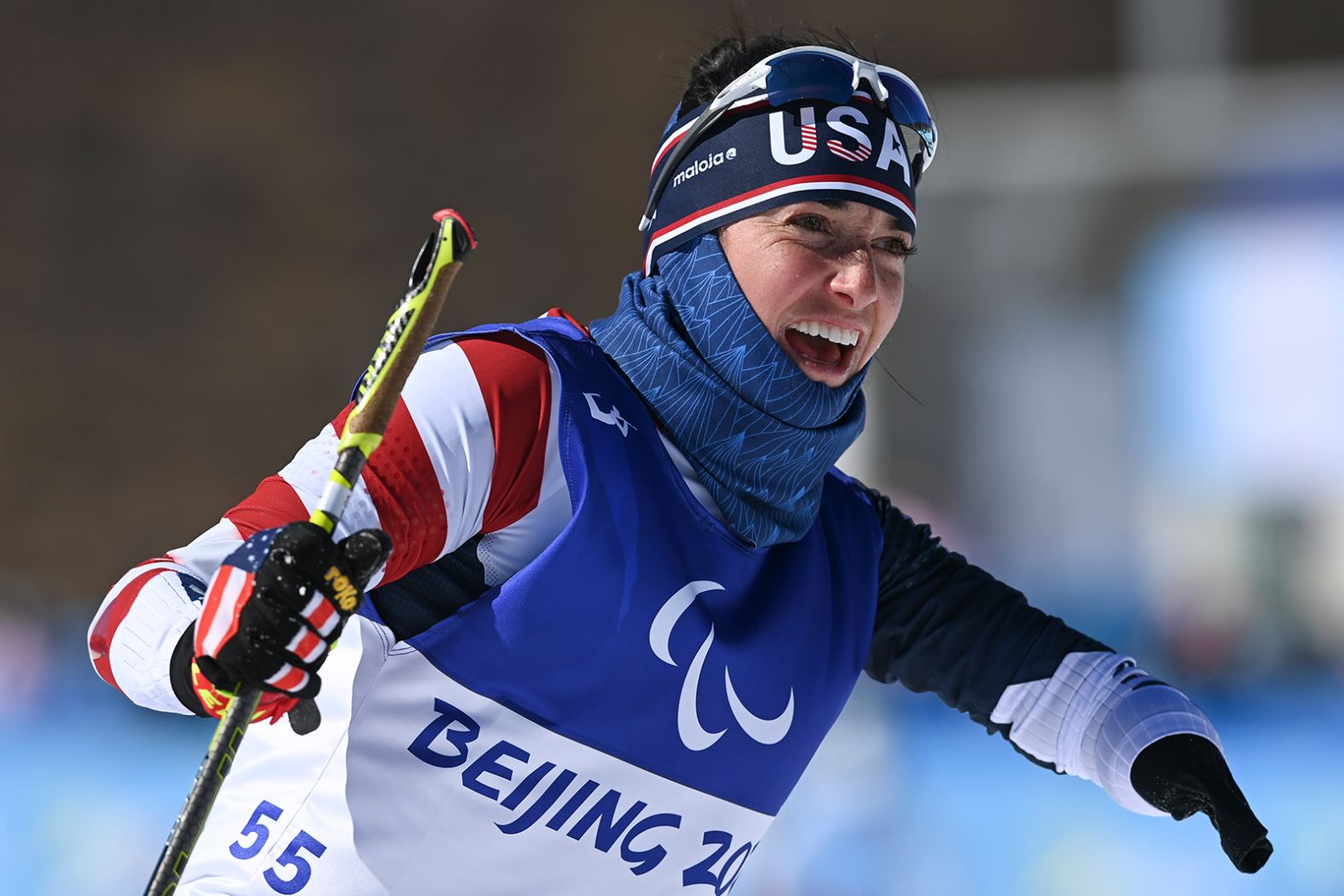 American biathlete Danielle Aravich smiles as she crosses the finish line on March 5.