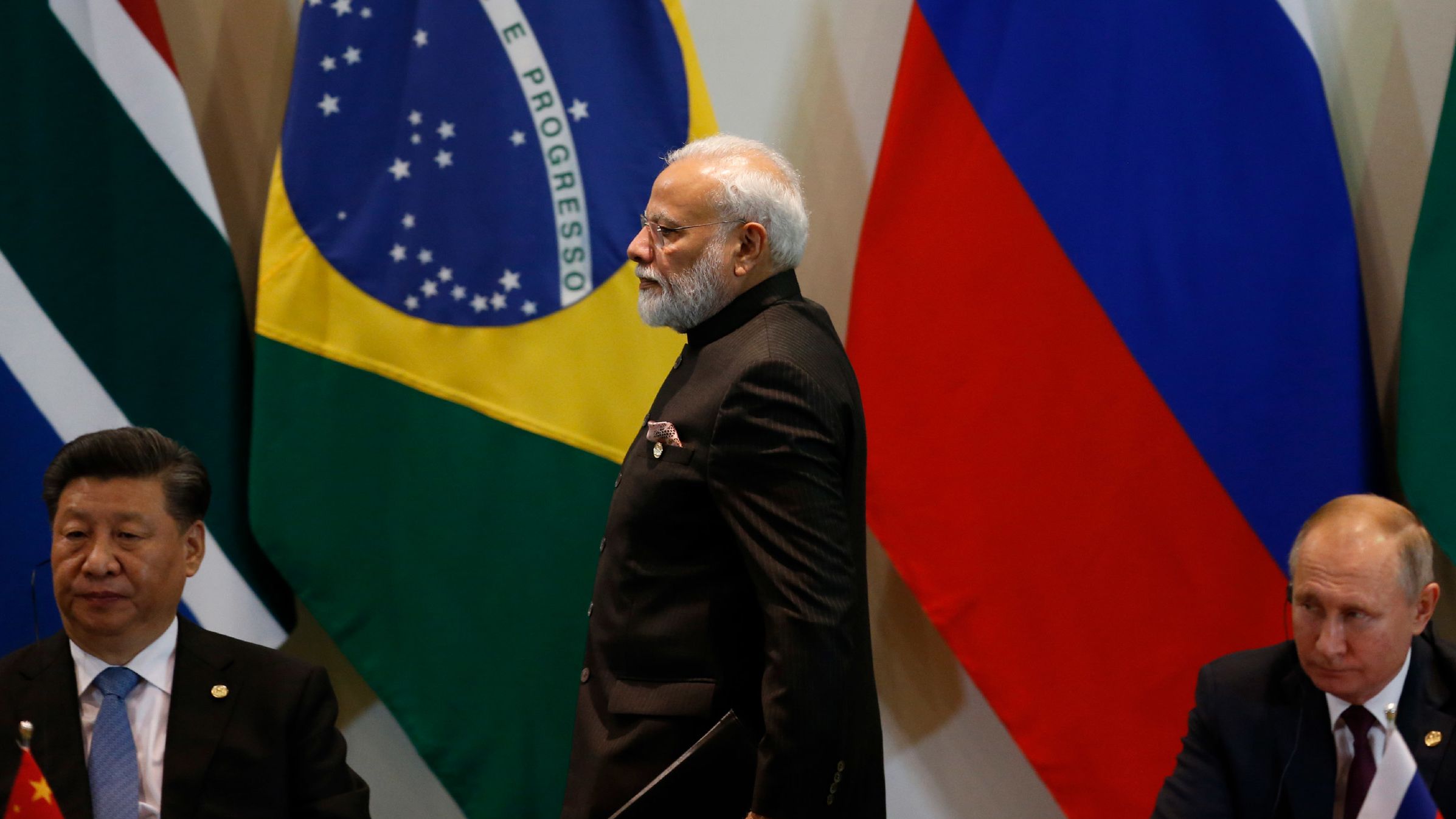 India's Prime Minister Narendra Modi, flanked China's President Xi Jinping, left, and Russia's President Vladimir Putin, at a BRICS Leaders Dialogue in Brazil in 2019. 