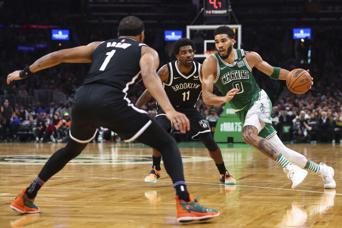 Tatum driving to the basket.