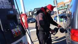 A Lukoil gas station attendant pumps gas in a customer's car on March 04, 2022 in the Canarsie neighborhood of Brooklyn in New York City. 