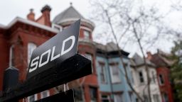 A sold sign is posted in front of a house in Washington, DC, on February 26, 2022.