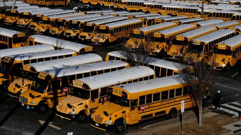 School buses are parked at the Arlington County Bus Depot, on January 26, 2022, in Arlington, Virginia. -