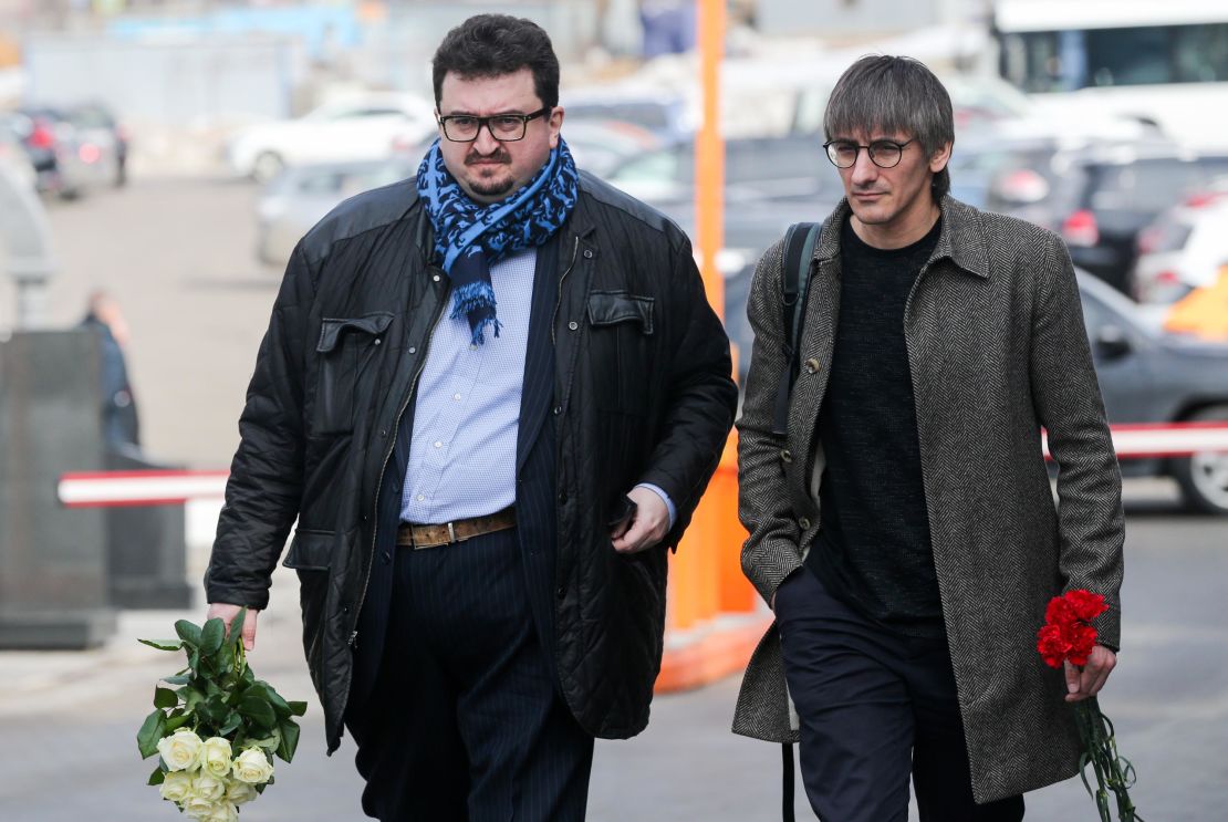 TV Rain journalist Mikhail Fishman (R) is seen with journalist Alexander Budberg.