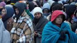 Refugees, mostly women and children, wait in a crowd for transportation after fleeing from the Ukraine and arriving at the border crossing in Medyka, Poland, Monday, March 7, 2022. Hundreds of thousands of Ukrainian civilians attempting to flee to safety Sunday were forced to shelter from Russian shelling that pummeled cities in Ukraine's center, north and south. (AP Photo/Markus Schreiber)