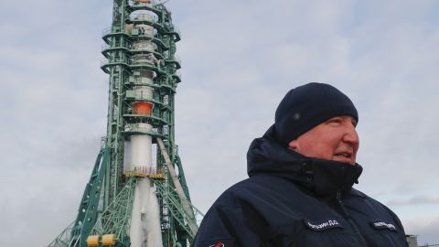 The head of Russia's Roscosmos space agency, Dmitry Rogozin, stands in front of the Soyuz MS-20 spacecraft at the Baikonur cosmodrome on December 8, 2021. 