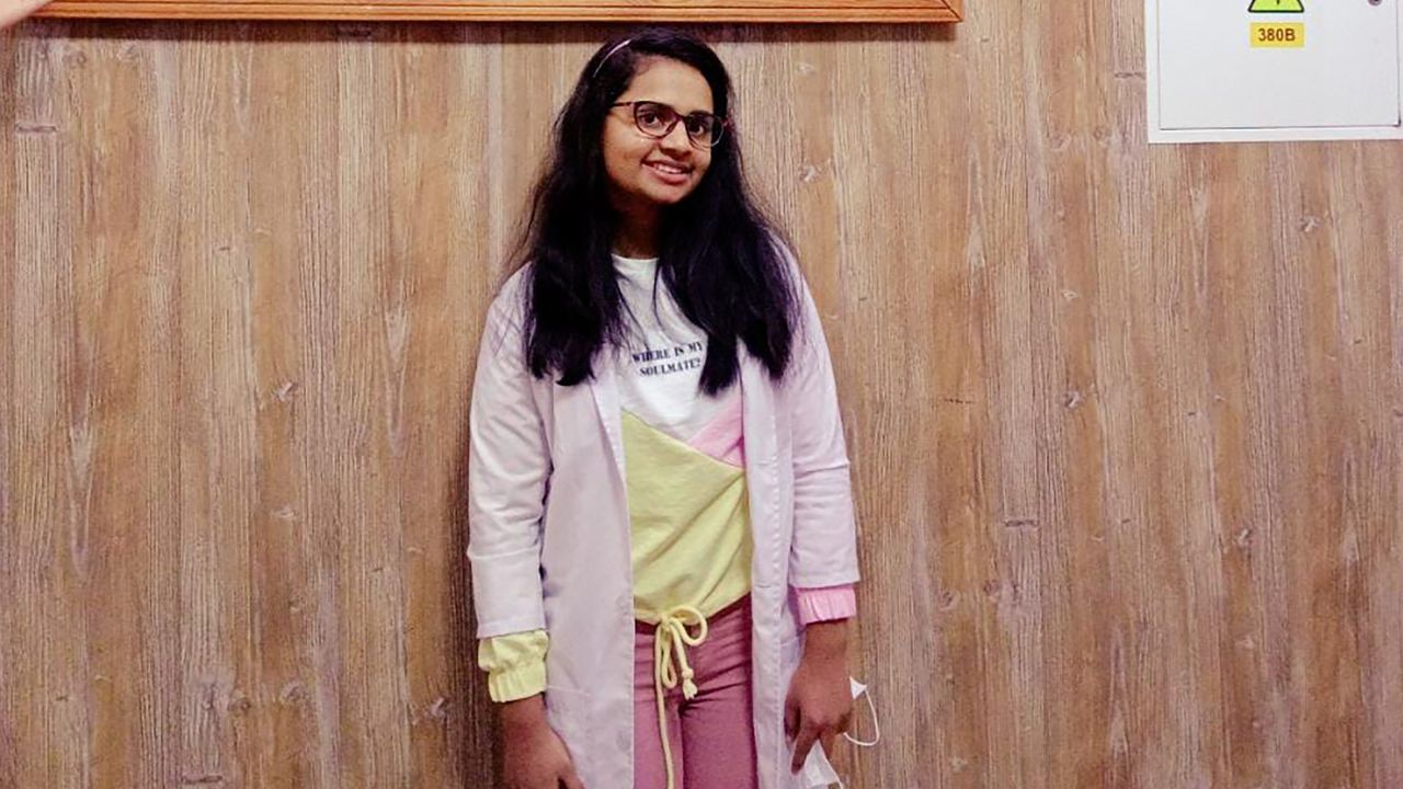 Merlyn Shebu, pictured in her lab coat before the war, was excited at the prospect of becoming a doctor.
