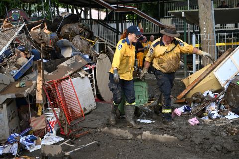 Volunteers from the local Rural Fire Brigade clean up a primary school in Tumbulgum, on March 6.