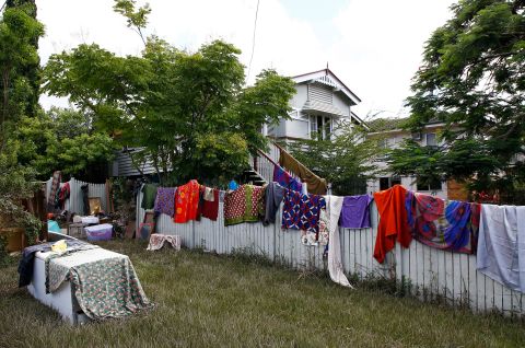 Blankets and sheets dry outside a flooded house in Brisbane on March 2.