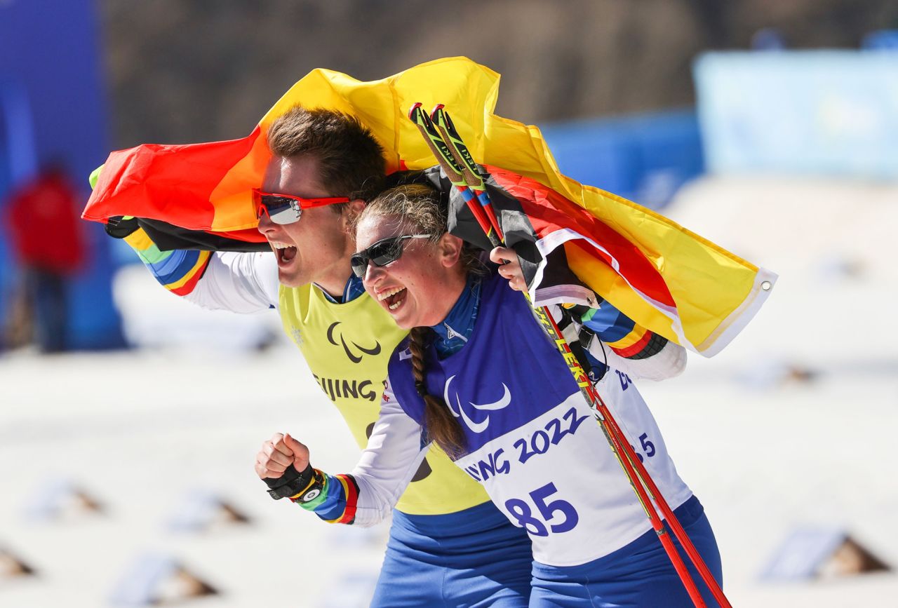 Germany's Leonie Maria Walter celebrates with her guide, Pirmin Strecker, after winning gold in a biathlon event on March 8.