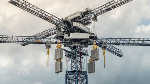 35-ton blocks, made of recycled or locally sourced materials, are raised to the top of the crane where they store energy.