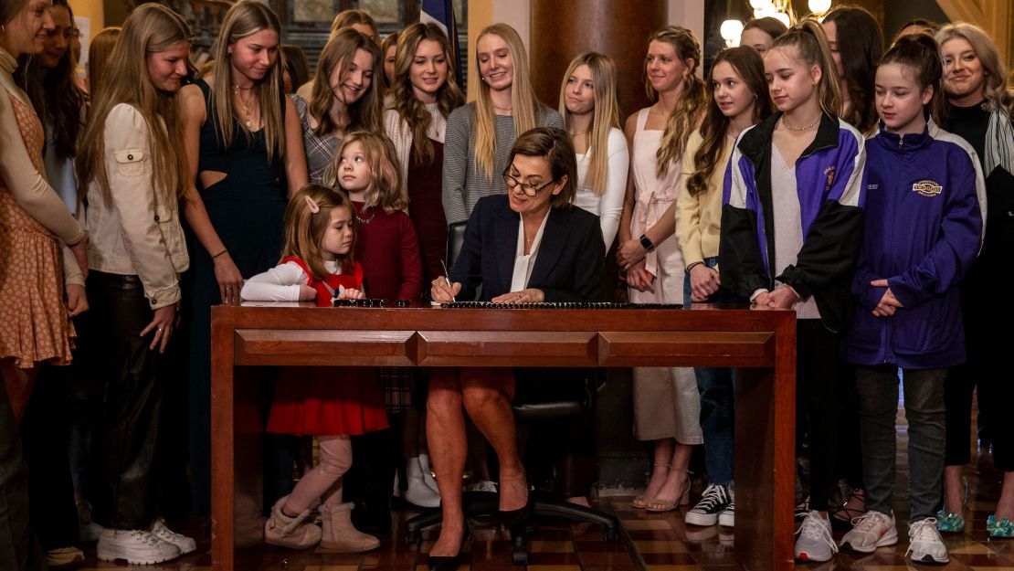 Iowa Gov. Kim Reynolds signs House File 2416 at The Iowa State Capitol in Des Moines, Iowa, last week.