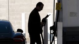 A driver removes a gas nozzle at a Shell gas station in San Francisco, California, on Friday, Feb. 25, 2022. 