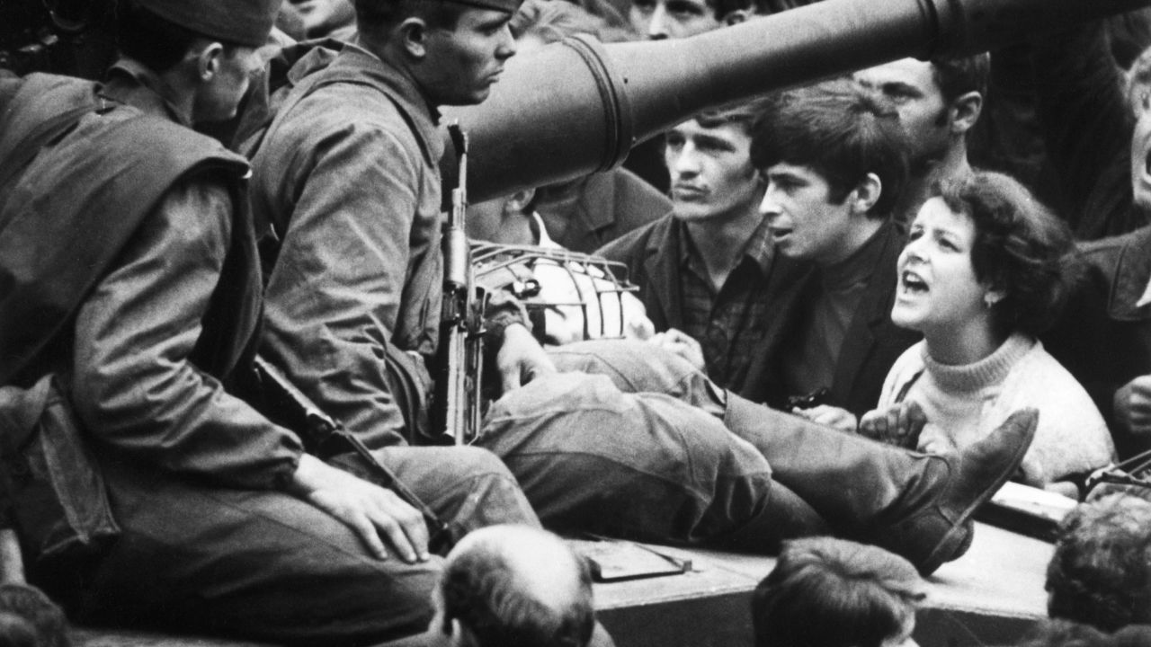 A Czech woman yells at soldiers sitting on tanks in the streets of Prague in August, 1968.