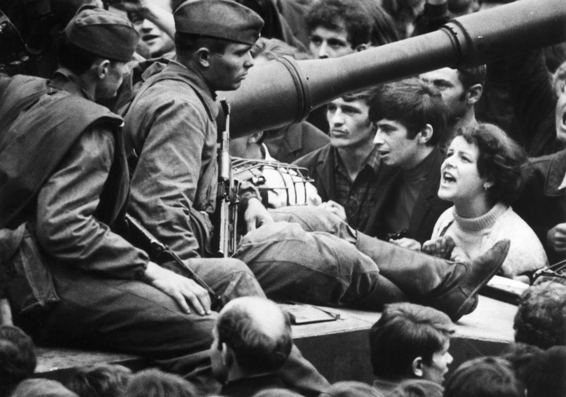 A Czech woman yells at soldiers sitting on tanks in the streets of Prague in August, 1968.