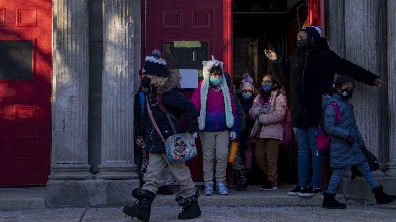Student wear masks as they leave a Chicago elementary school on January 3.