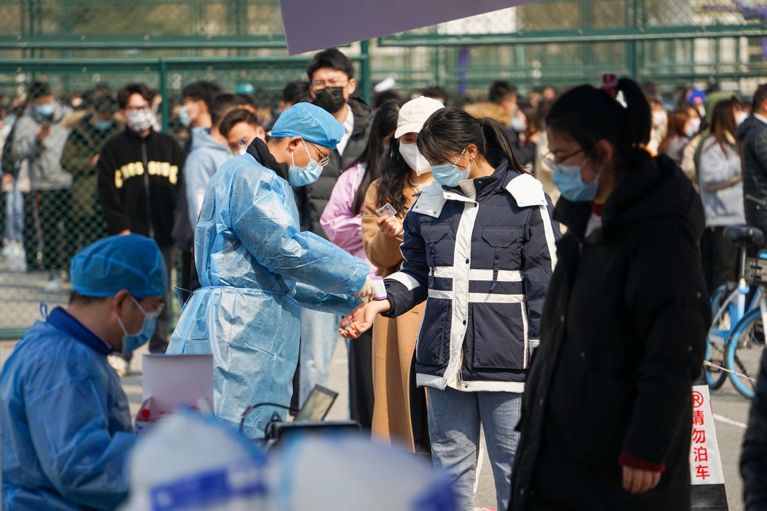 Students line up for Covid-19 testing at Qingdao Agricultural University on March 7 in China's Qingdao city.