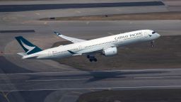 An aircraft operated by Cathay Pacific Airways Ltd. takes off from Hong Kong International Airport in Hong Kong, China, on Thursday, Jan. 6, 2022. Hong Kong is imposing strict new virus control measures for the first time in almost a year as the highly transmissible omicron variant seeps into the community and threatens to spur a winter wave. Photographer: Paul Yeung/Bloomberg via Getty Images