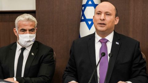 (R to L) Israeli Prime Minister Naftali Bennett chairs the weekly cabinet meeting, with Foreign Minister Yair Lapid, at the prime minister's office in Jerusalem on February 20.