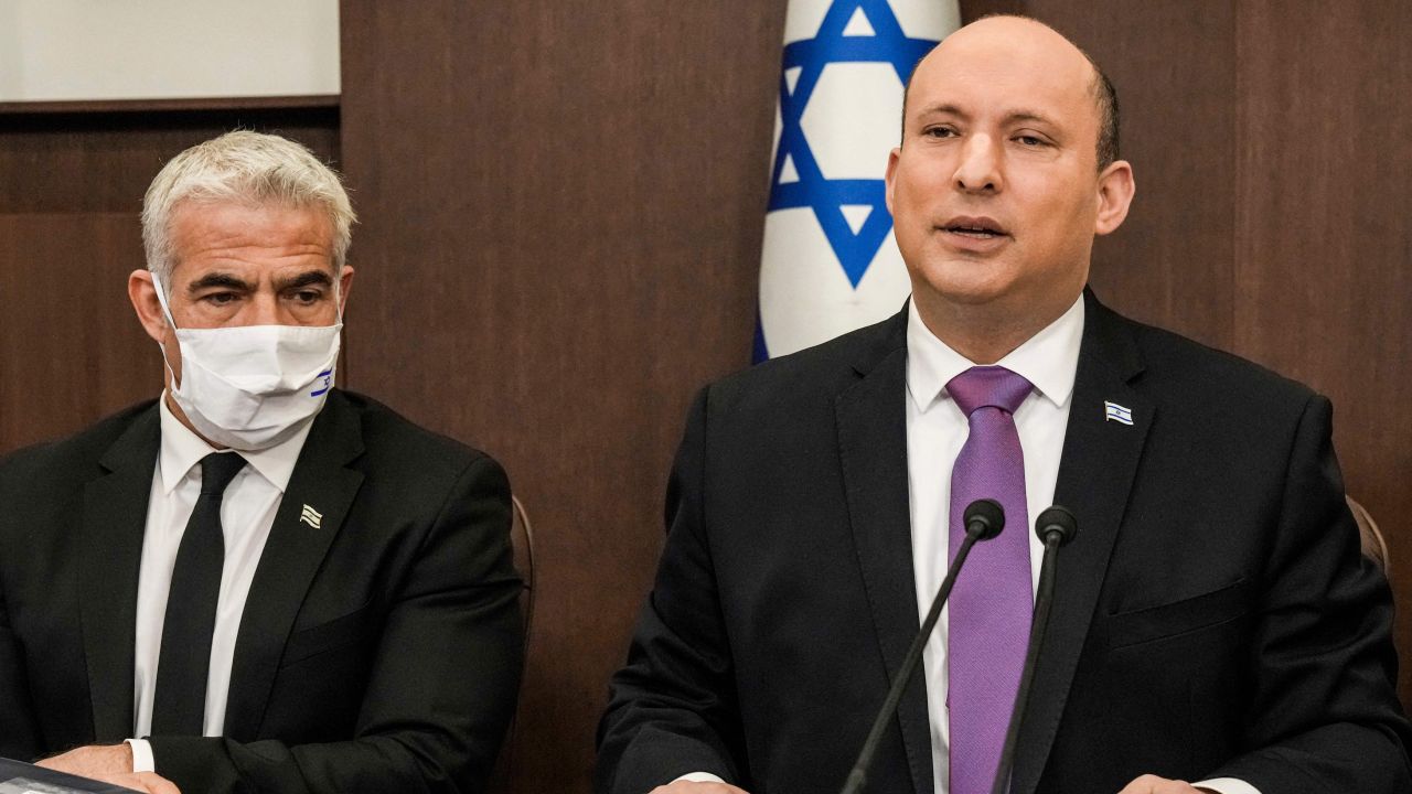(R to L) Israeli Prime Minister Naftali Bennett chairs the weekly cabinet meeting, with Foreign Minister Yair Lapid, at the prime minister's office in Jerusalem on February 20.