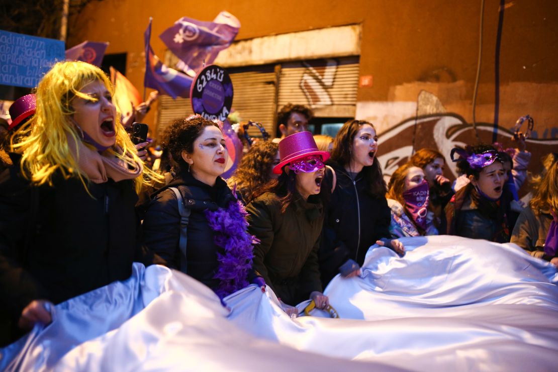 Protesters shout slogans as they march to mark International Women's Day in Istanbul, Turkey, on Tuesday. 