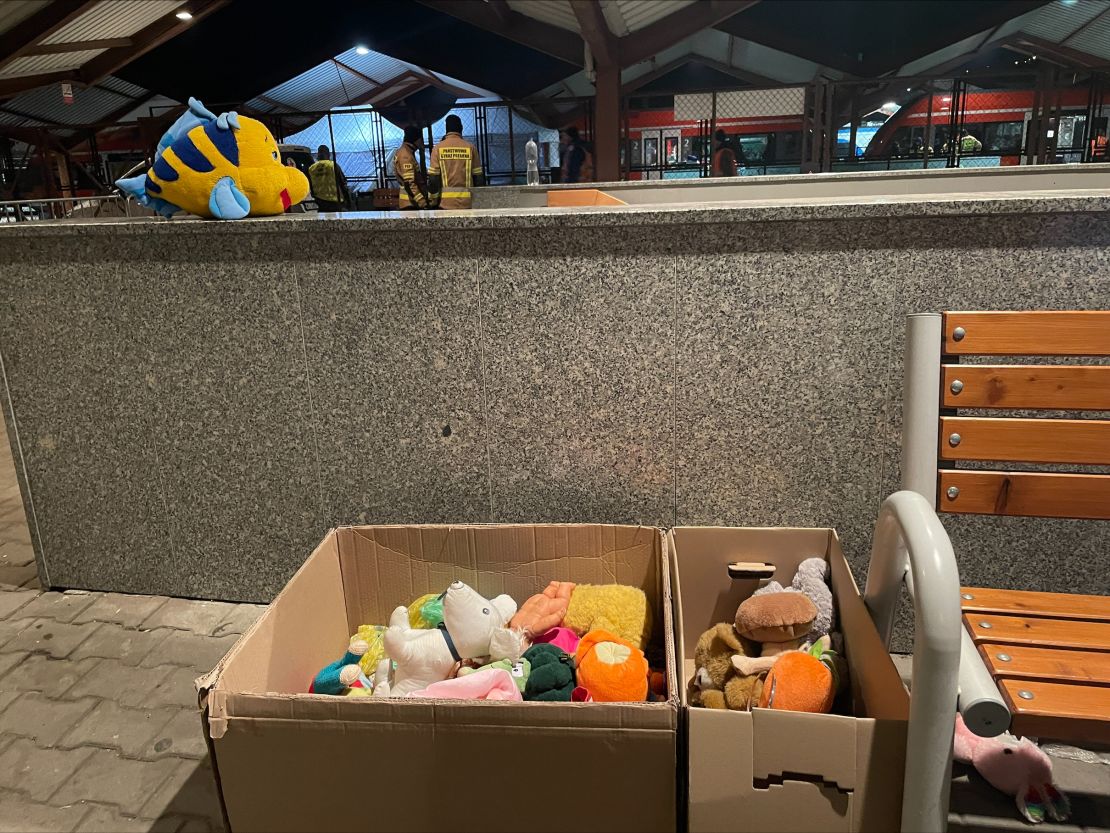 Carboard boxes filled with toys and stuffed animals await new owners.