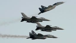 Two Polish Air Force Russian-made MiG-29's fly above and below two Polish Air Force US-made F-16's fighter jets during the Air Show in Radom, Poland, on August 27, 2011. On March 8, 2022, the US Defense Department rejected a proposal from Poland to transfer its MiG-29 fighter jets to a US Air Force base in Germany for delivery to Ukraine in its war against Russia.