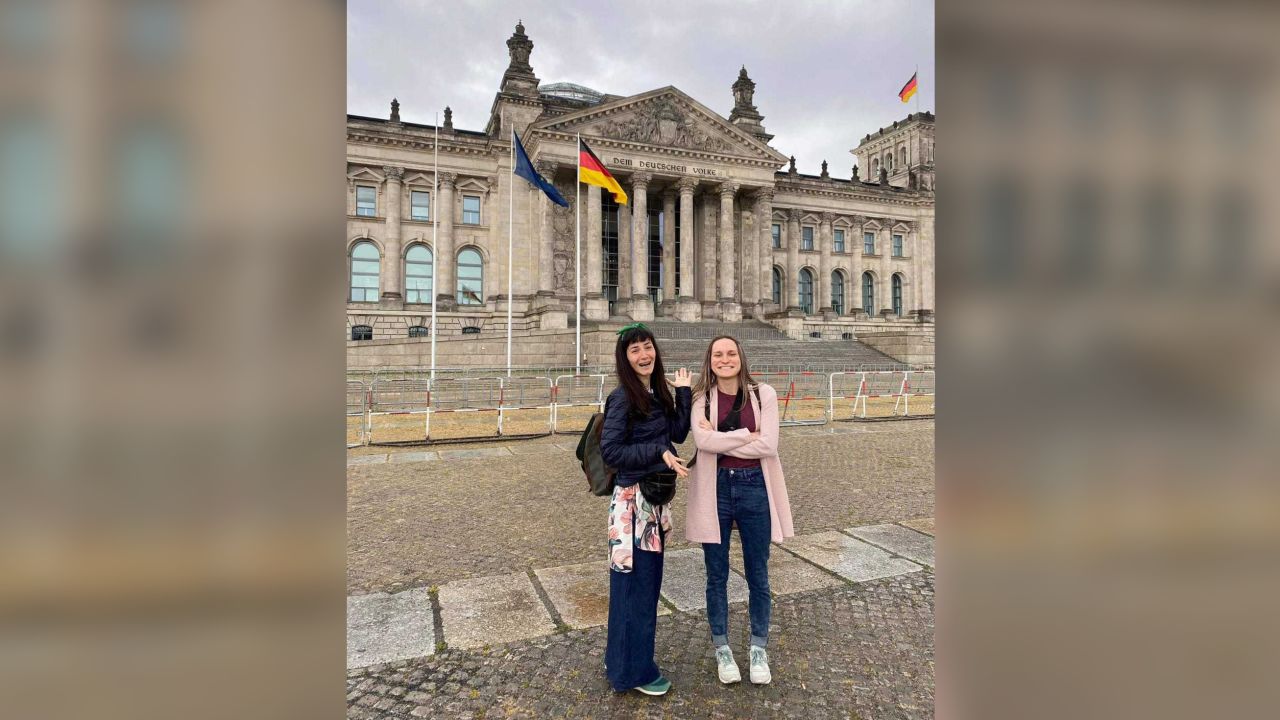 Isabel, left, and Anastasiya pose in front of the German Bundestag in Berlin.