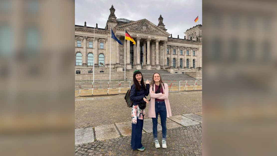 Isabel, left, and Anastasiya pose in front of the German Bundestag in Berlin.