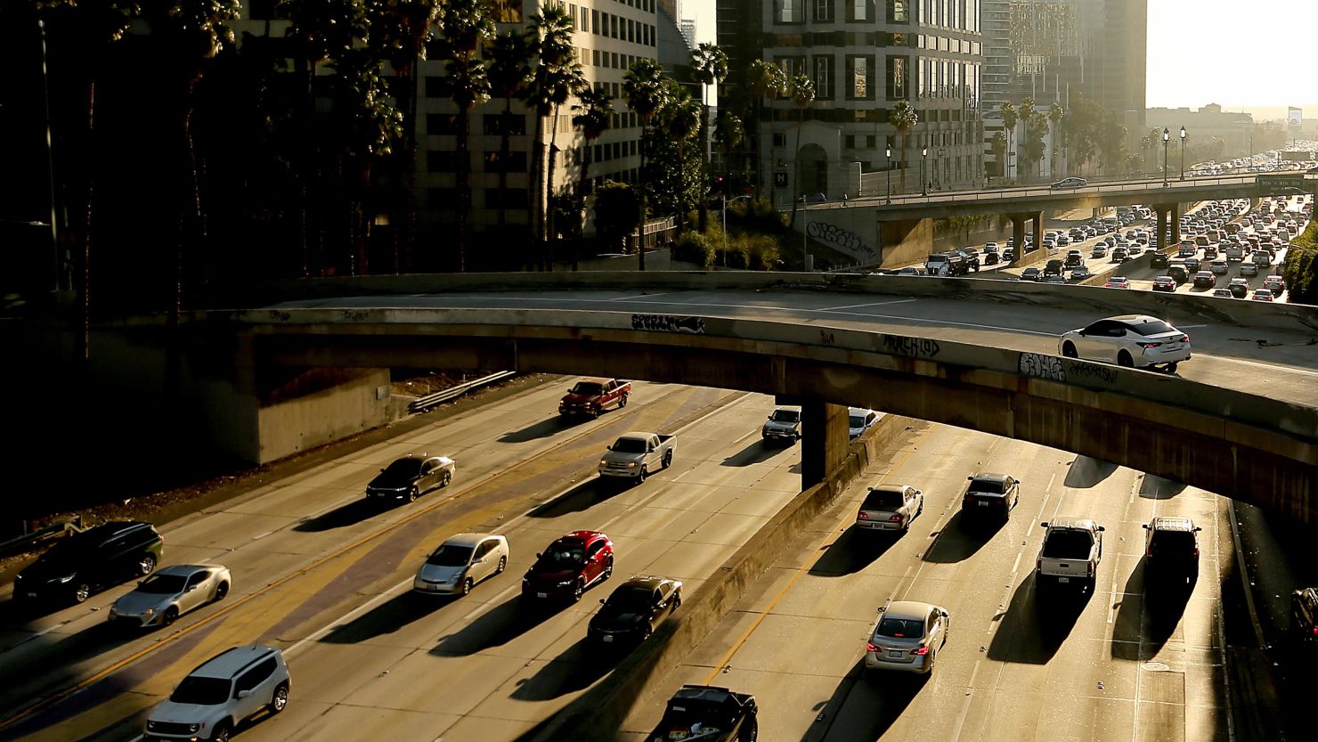Traffic slows on the Harbor Freeway in downtown Los Angeles in November 2021. The EPA announced Wednesday that it would allow California to adopt stricter vehicle emissions standards than the federal rules.