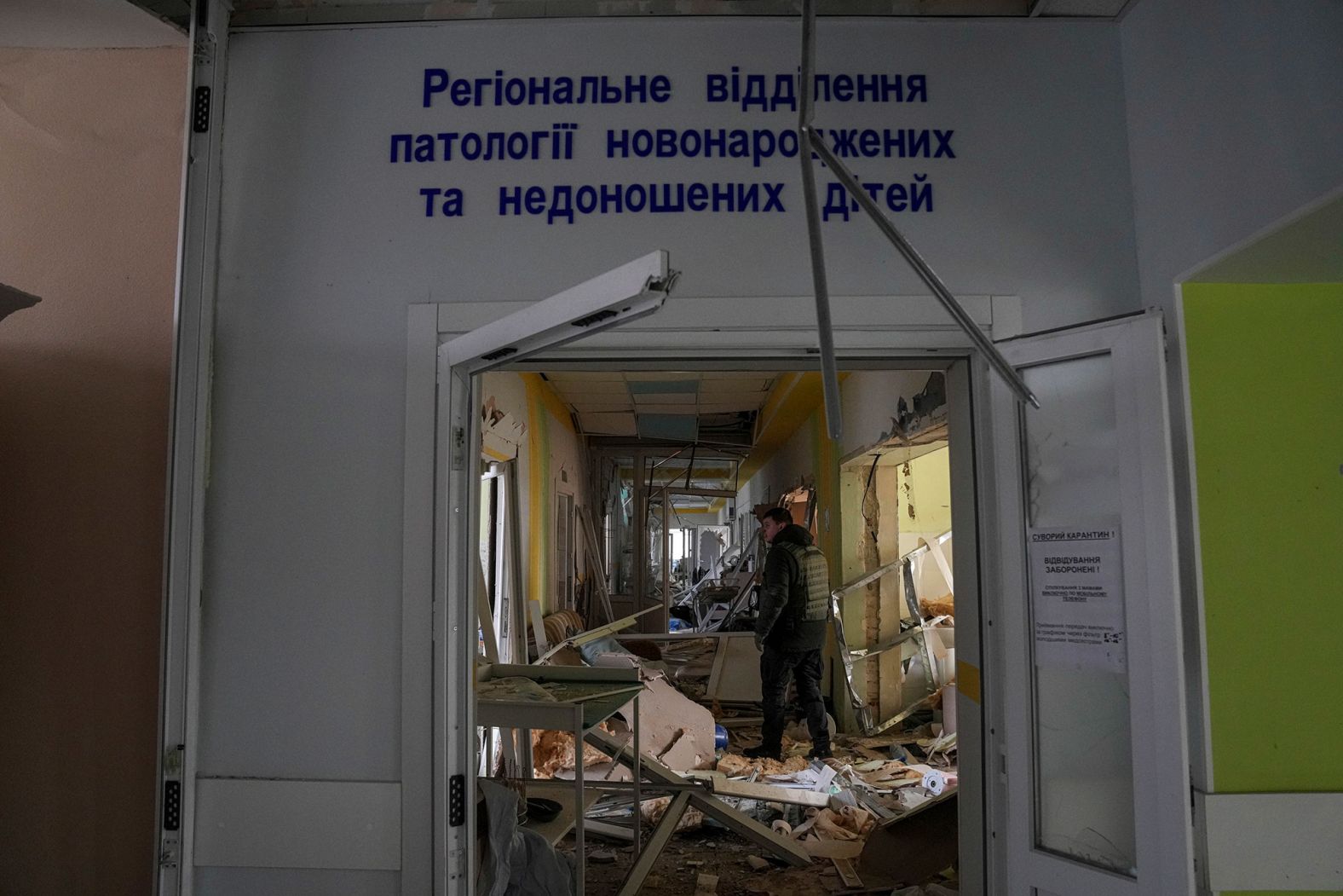 A volunteer surveys the damage.