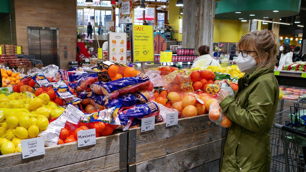 A shopper bags fruit inside a supermarket in Chevy Chase, Maryland on February 17, 2022. - US retail sales boomed in January as shops more than regained ground lost in an unexpected December slump, despite high inflation, according to government data released February 16. Retail sales rose 3.8 percent last month, the Commerce Department said, double what was expected and a dramatic reversal of the 2.5 percent decline in December, which was worse than originally reported. (Photo by MANDEL NGAN / AFP) (Photo by MANDEL NGAN/AFP via Getty Images)