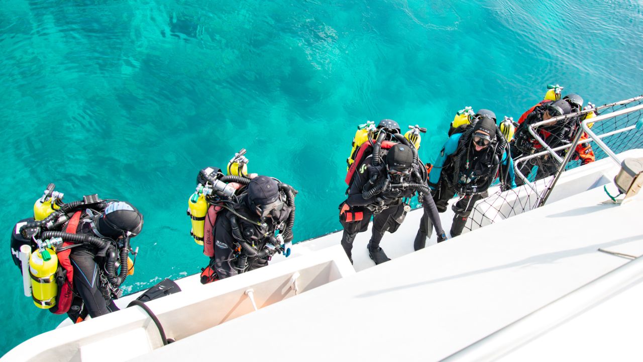 Rocha and a team of divers prepare to explore the twilight zone reefs of the Maldives during a recent expedition.