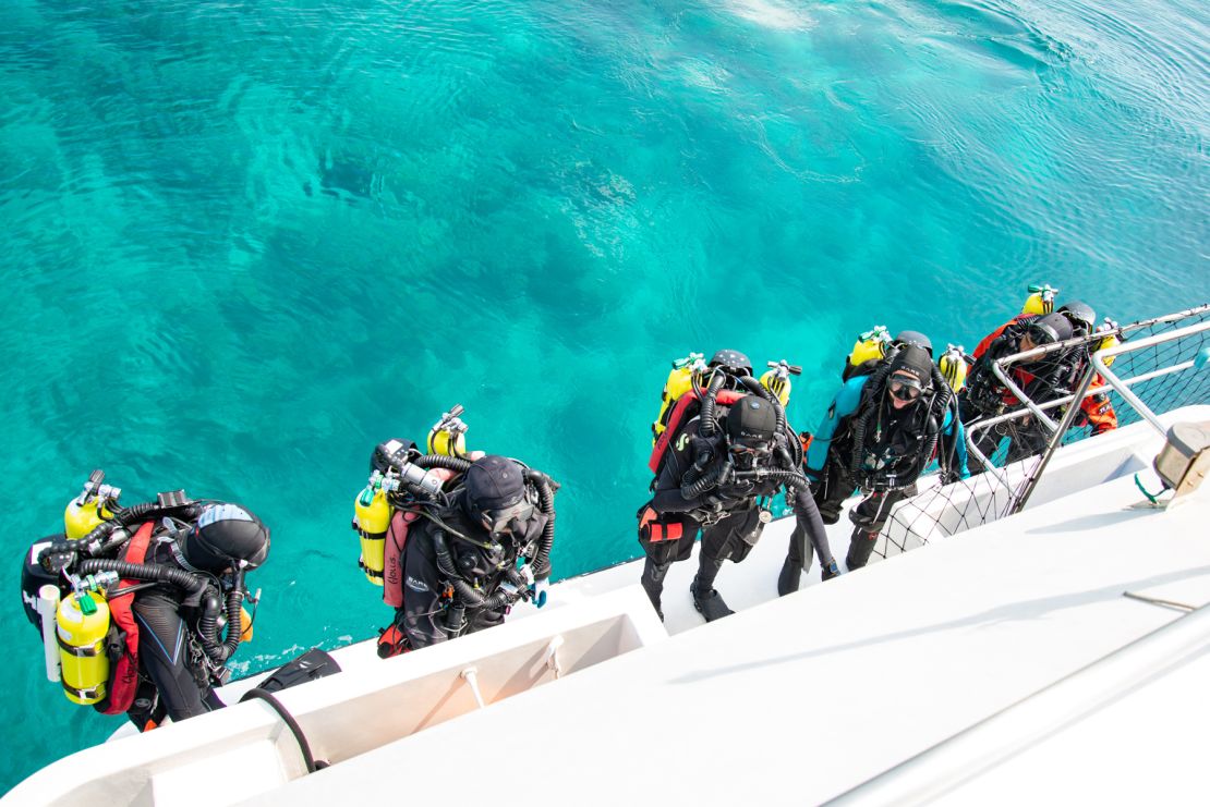 Rocha and a team of divers prepare to explore the twilight zone reefs of the Maldives during a recent expedition.