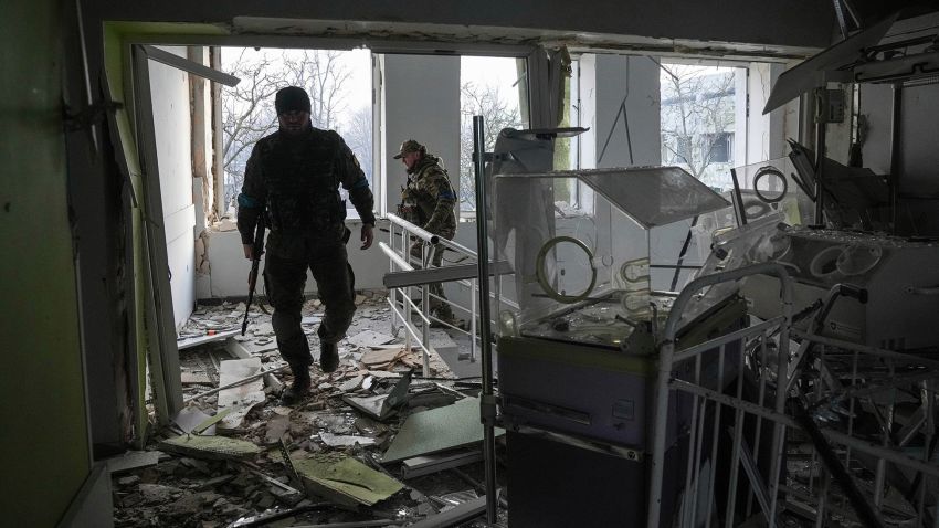 Ukrainian servicemen work inside of the damaged by shelling maternity hospital in Mariupol, Ukraine, Wednesday, March 9, 2022. A Russian attack has severely damaged a maternity hospital in the besieged port city of Mariupol, Ukrainian officials say. (AP Photo/Evgeniy Maloletka)