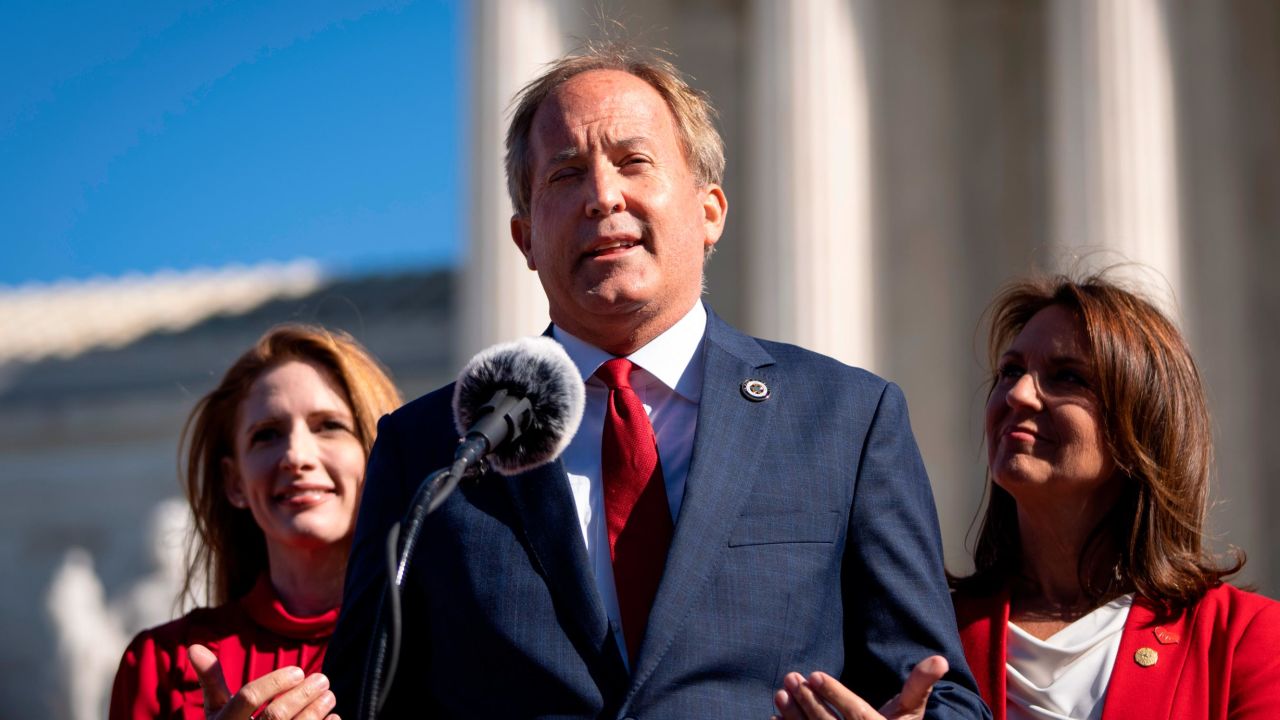 Texas Attorney General Ken Paxton speaks outside the Supreme Court in Washington, DC, on November 1, 2021.