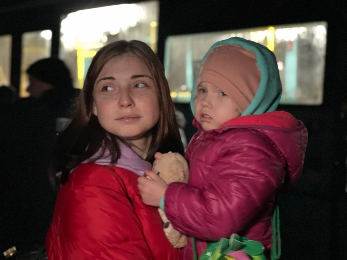 Krystina Ponomaryova, 21, and her two-year-old daughter Angelina after getting off the bus that brought them to safety.